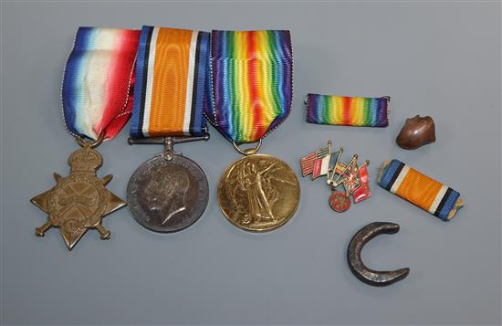 A WWI trio of medals and related items